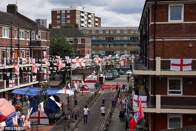 Football fans gather in the Kirby estate on July 14 ahead of the Euros final