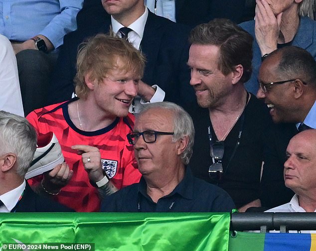 The singer, 33, - who is a huge football fan - was taking in all the action at the Olympiastadion, with actor Damian, 53, by his side