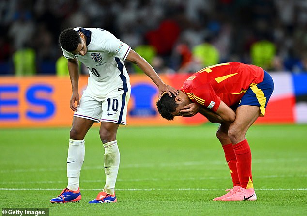 Jude Bellingham checks on the Man City and Spain midfielder before they head for the tunnel