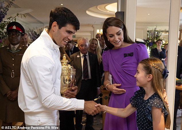 Winning smiles: Princess Charlotte shakes hands with the winner, with Kate looking on, following Carlos Alcaraz's victory over Novak Djokovic