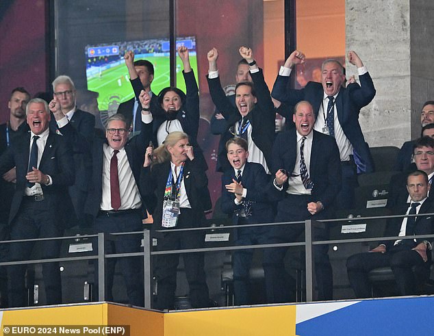 The father and son seen jumping up out of their seats and shouted in celebration alongside Keir Starmer