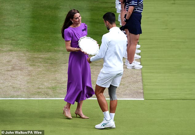 The heavy crepe of the full skirt ensured there was not a crease to be seen as the princess made her way on to the court to present the trophies