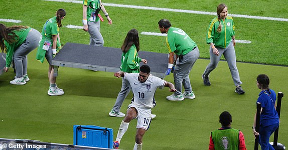 BERLIN, GERMANY - JULY 14: Jude Bellingham of England reacts after defeat to Spain as he kicks over a Powerade Cooler Box as he leaves the field after the UEFA EURO 2024 final match between Spain and England at Olympiastadion on July 14, 2024 in Berlin, Germany. (Photo by Justin Setterfield/Getty Images)