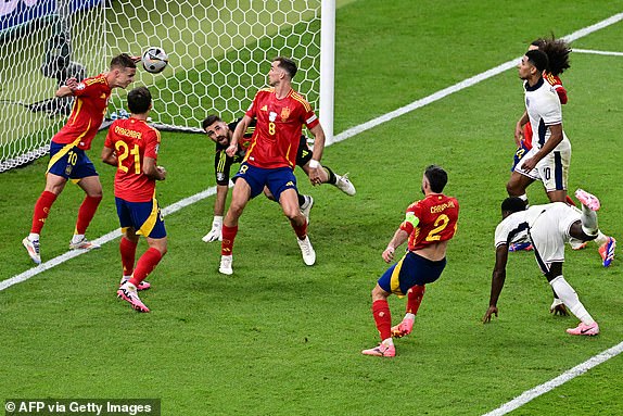 TOPSHOT - Spain's forward #10 Daniel Olmo heads the ball clear during the UEFA Euro 2024 final football match between Spain and England at the Olympiastadion in Berlin on July 14, 2024. (Photo by Tobias SCHWARZ / AFP) (Photo by TOBIAS SCHWARZ/AFP via Getty Images)