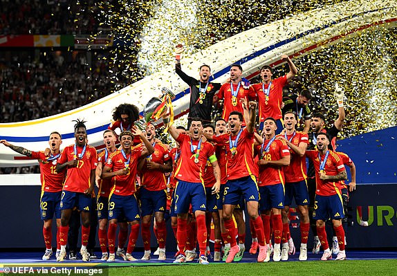 BERLIN, GERMANY - JULY 14: Alvaro Morata of Spain lifts the UEFA Euro 2024 Henri Delaunay Trophy after his team's victory  during the UEFA EURO 2024 final match between Spain and England at Olympiastadion on July 14, 2024 in Berlin, Germany. (Photo by Michael Regan - UEFA/UEFA via Getty Images)