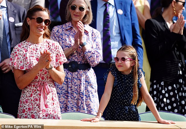 Pippa looked effortlessly elegant in a slim-fitting red floral midi dress with ruffled tiers