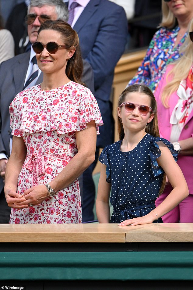 Pip off the old block: Kate's sister looked every inch the doting aunt next to Princess Charlotte