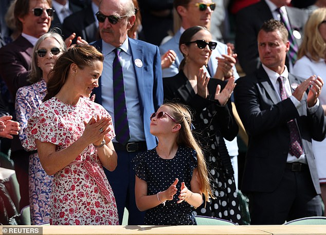 Princess Charlotte complemented her auntie Pippa in a navy-and-white polka dot dress from Guess with ruffled sleeves