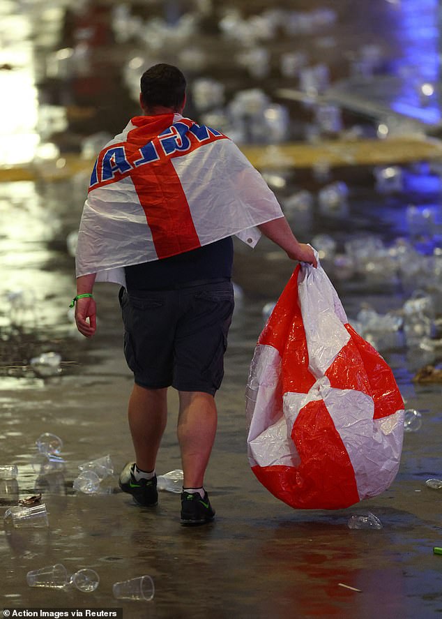 This supporter was seen leaving London's O2 with a deflated England blow up ball