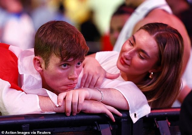 This supporter in Boxpark Wembley was comforted by a woman next to him after the loss