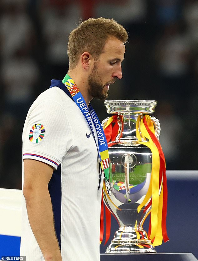 A heartbroken Harry Kane was seen walking past the trophy having almost bringing his side to clinching their first major tournament since the World Cup in 1966