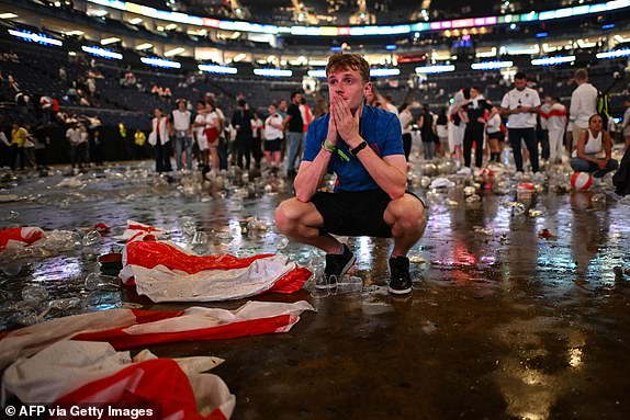 An England fan reacts after watching the UEFA Euro 2024 final football match between Spain and England being played in Berlin, during a screening at the O2 Arena in London on July 14, 2024. (Photo by JUSTIN TALLIS / AFP) (Photo by JUSTIN TALLIS/AFP via Getty Images)