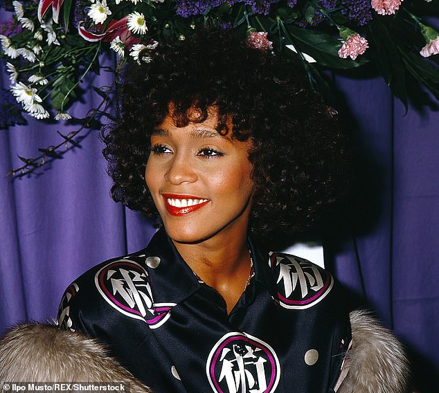 Swift's 12 weeks atop the chart also surpassed a previous record held by late musical legend Whitney Houston, pictured in 1987 in London