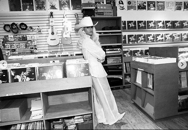 In the Reel she posted to Instagram, Bey draped herself dramatically over the record display featuring her country album. Beyoncé Instagram