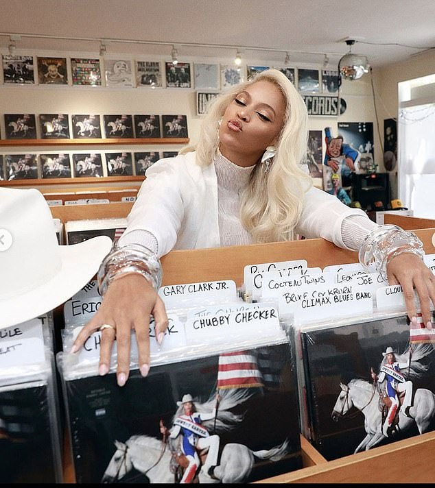 Beyoncé dressed up in a white suit, white cowboy hat, and clear, lucite bangle bracelets and went to Innersleeve Records in Amagansett, New York. Beyoncé Instagram