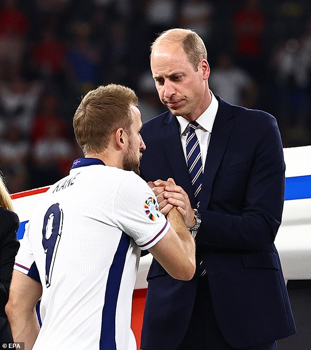 Captain Harry Kane shakes hands with the Prince of Wales as he goes up to collect his runners-up medal