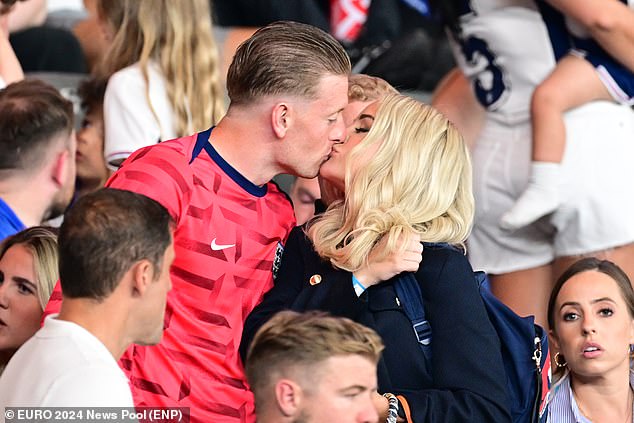 Megan Pickford comforts her husband Jordan by packing on the PDA