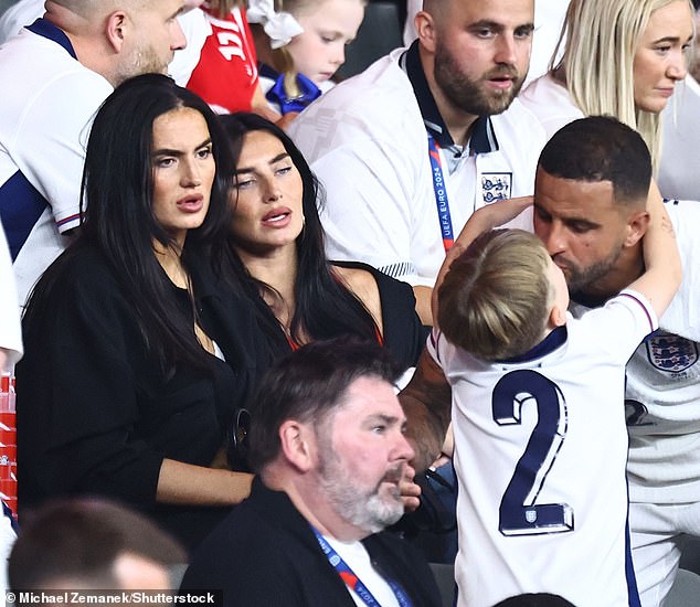 Kyle Walker kissed his son as she was reunited with wife Annie Kilner following the game