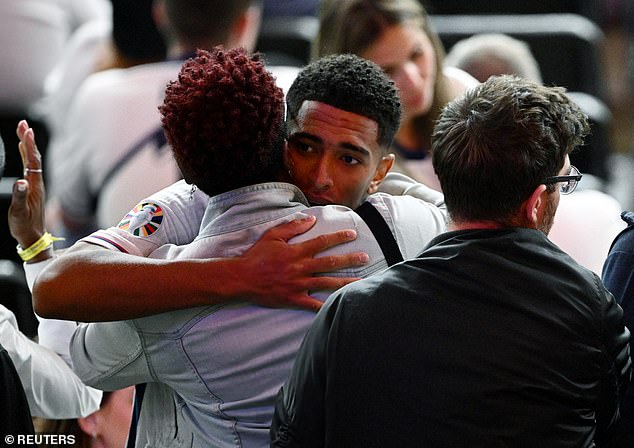 Jude Bellingham was also consoled by family and friends as they hugged him after the game