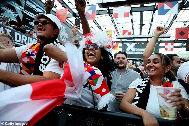 Supporters in Europe react as they watch the final unfold at Boxpark Croydon, south London