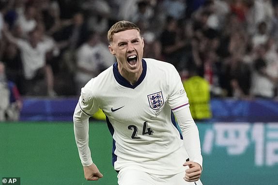 England's Cole Palmer celebrates after scoring his side's opening goal during the final match between Spain and England at the Euro 2024 soccer tournament in Berlin, Germany, Sunday, July 14, 2024. (AP Photo/Frank Augstein)