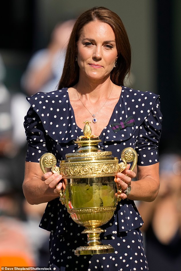 In 2022 she pinned the bow to her chest alongside her Alessandra Rich navy dress polka dot dress