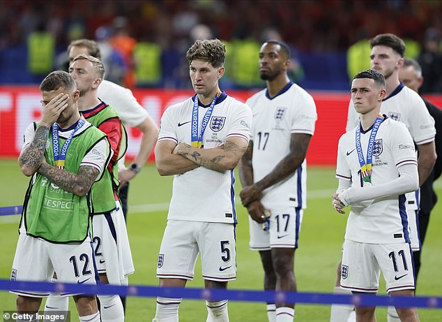 Kieran Trippier, Jarrod Bowen, John Stones, Ivan Toney, Phil Foden and Declan Rice of England look dejected after their were giving their runners-up medals