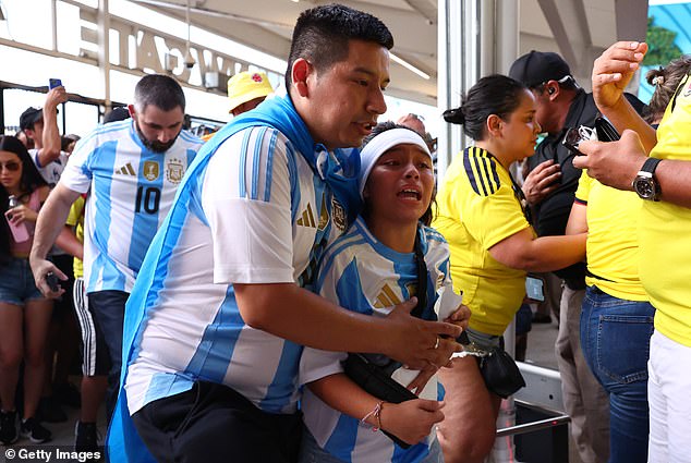 Panicked fans try to gain entry into the Hard Rock Stadium in Miami amid Sunday's chaos