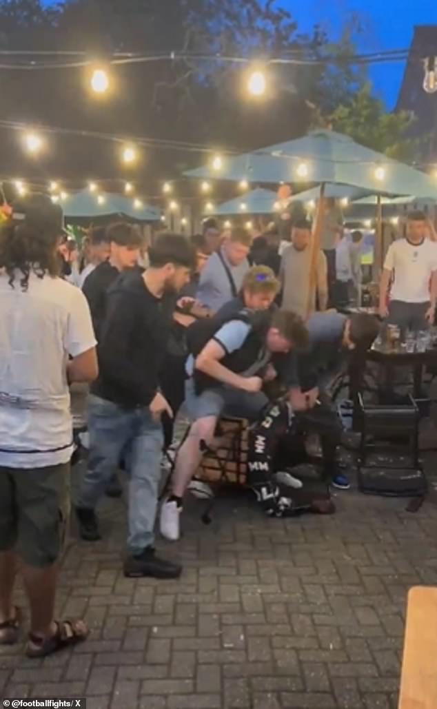 WELWYN -- Shocking footage from last night shows some Three Lions fans fighting each other in the village as two brutes are seen raining down punches on another man