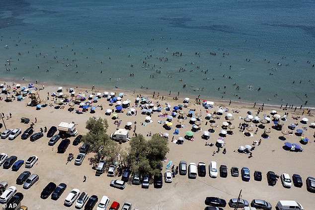 A general view of a crowded beach at Varkiza suburb, south of Athens, Greece, on Sunday