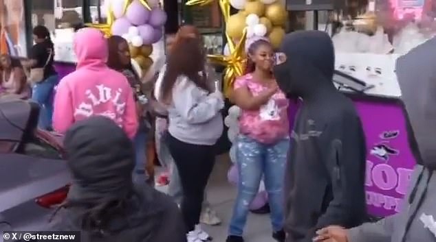 Just moments before gunfire broke out, a crowd of people were seen celebrating outside of Glamor Beauty Supply on Telegraph Avenue