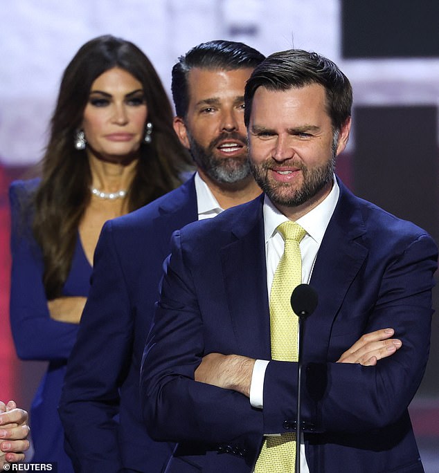 Donald Trump Jr., Vice President nominee JD Vance and Kimberly Guilfoyle stand on the stage ahead of day two of the Republican National Convention