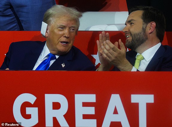 Republican presidential nominee and former U.S. President Donald Trump speaks with Republican vice presidential nominee J.D. Vance on Day 2 of the Republican National Convention (RNC), at the Fiserv Forum in Milwaukee, Wisconsin, U.S., July 16, 2024. REUTERS/Brian Snyder