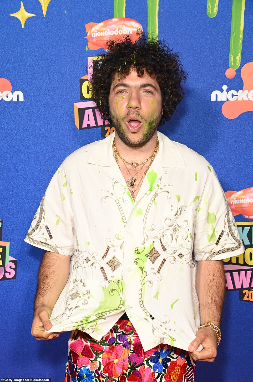 Blanco flashed a peace sign during the photo session, while also taking a humorous snap as he showed the green slime splattered on his ensemble and also his face