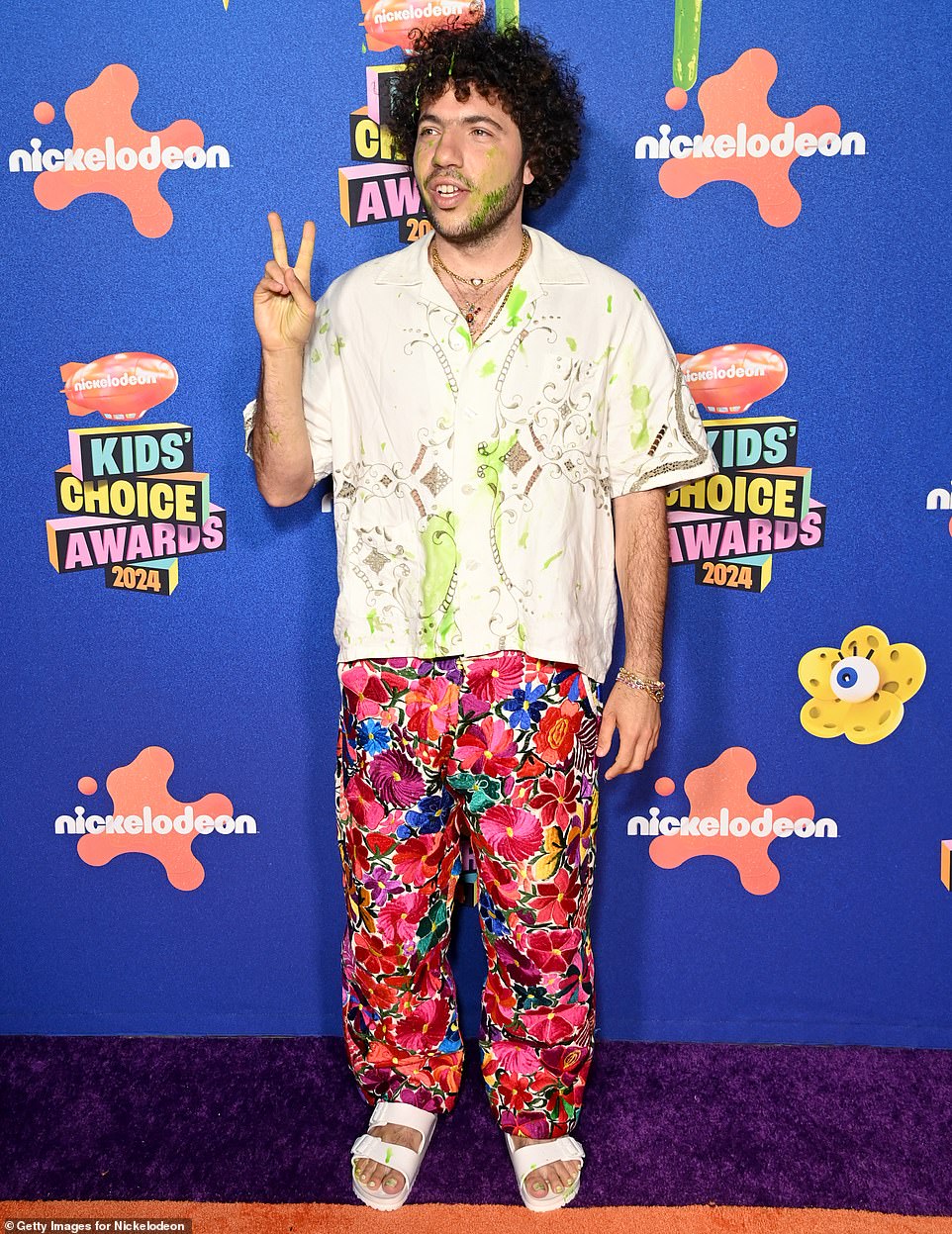 Benny Blanco showed off a bit of green slime on his outfit as he walked the red carpet on Saturday