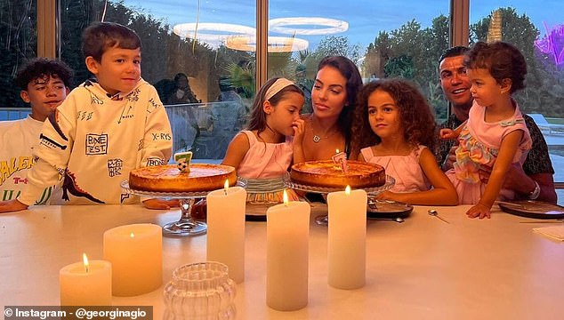 Georgina and Cristiano's whole family pictured in June. The couple began dating in 2016 when she caught his attention working as a sales assistant in a Madrid Gucci shop