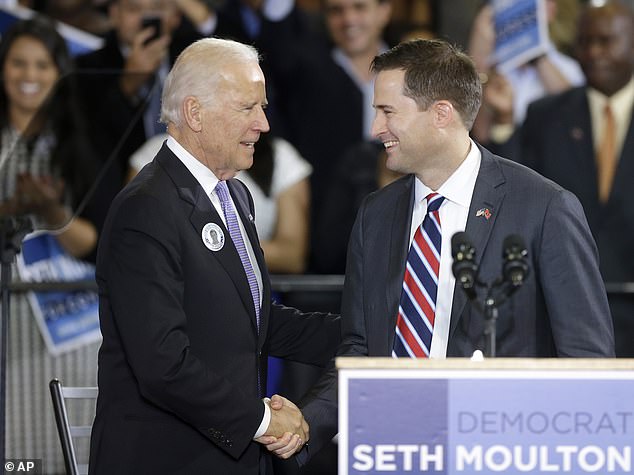 Then Vice President Joe Biden (left) is photographed campaigning for Seth Moulton (right) in Lynn, Massachusetts in October 2014. Moulton wrote in an op-ed for The Boston Globe that Biden didn't seem to recognize him when they saw each other in Normandy in June