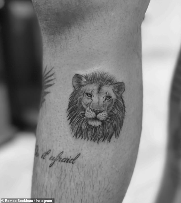 The footballer shared an image of a lion's face on his arm above the words: 'Do it afraid'