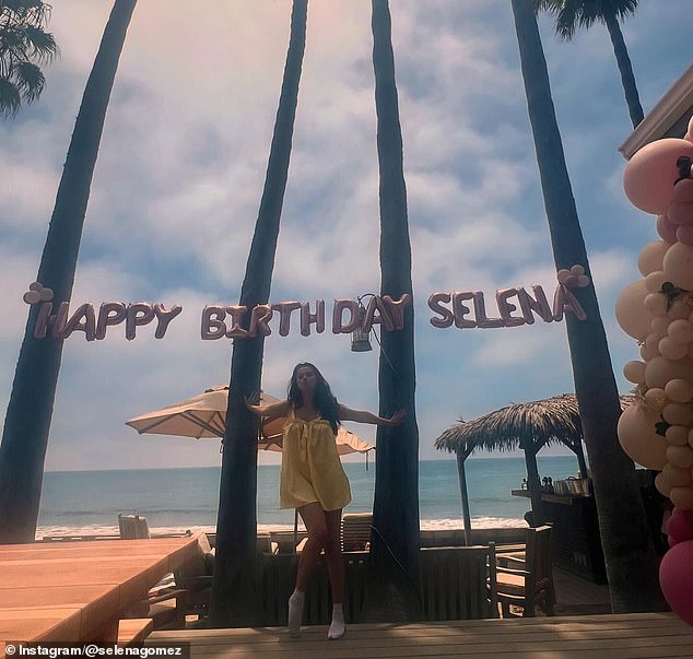 She wore a yellow sundress with her chocolate brown hair down in soft waves and light makeup for her birthday celebration.