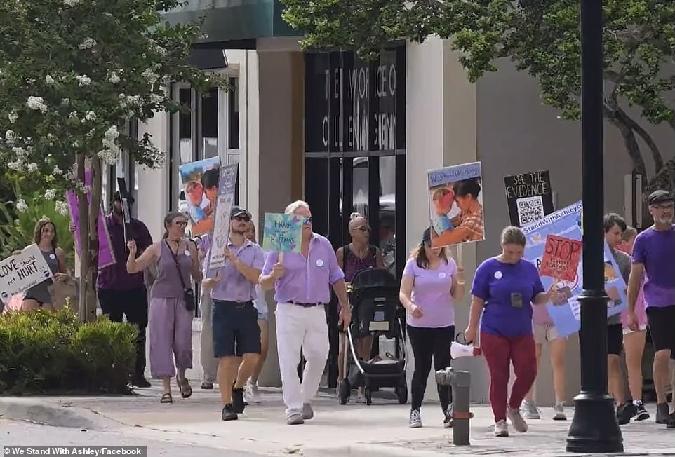 Outside of the Florida courthouse on Monday, protesters showed their support for the former ballerina. 'We really are standing for Ashley,' her pastor, Mike Brown, told Fox 13. 'We have a group of domestic violence survivors who are standing with us, ready to see justice prevail.' Ashley now faces a minimum sentence of 25 years behind bars and a maximum sentence of life in prison if found guilty of Doug's murder following the two-week-long trial.