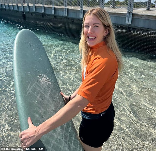 Ellie, who split from her estranged husband Caspar Jopling earlier this year, also shared a beaming snap with her surf board as she entered the ocean