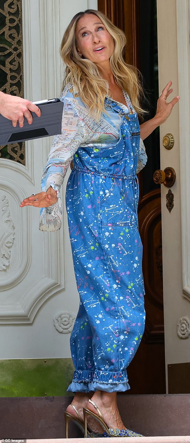 Sarah Jessica Parker was spotted on the set of 'And Just Like That..' wearing a denim jumpsuit accented by green, purple and white splatter paint