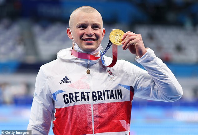 Adam, 29, who is widely considered the greatest men's breaststroke swimmer in history, is competing in his third Olympics (pictured at the Tokyo 2020 games)