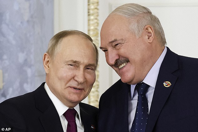 Vladimir Putin pictured with Belarus President Alexander Lukashenko, right, during a meeting of the Union State Supreme Council in St. Petersburg, Russia, earlier this year