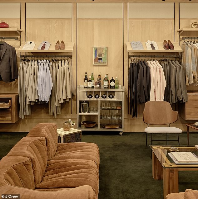 Modern design details like the white oak interior and wood-clad ceiling create a warm, clean and inviting atmosphere, while suede couches give a retro vibe