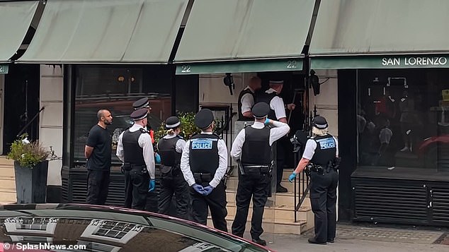 The ordeal has finally come to an end as police officers from the Met were pictured outside the restaurant