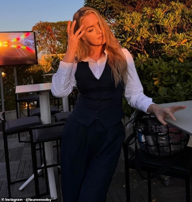 The sports presenter looked chic in a pair of black tailored trousers and fitting waistcoat with a crisp white blouse as she smiled in a series of sun-kissed snaps