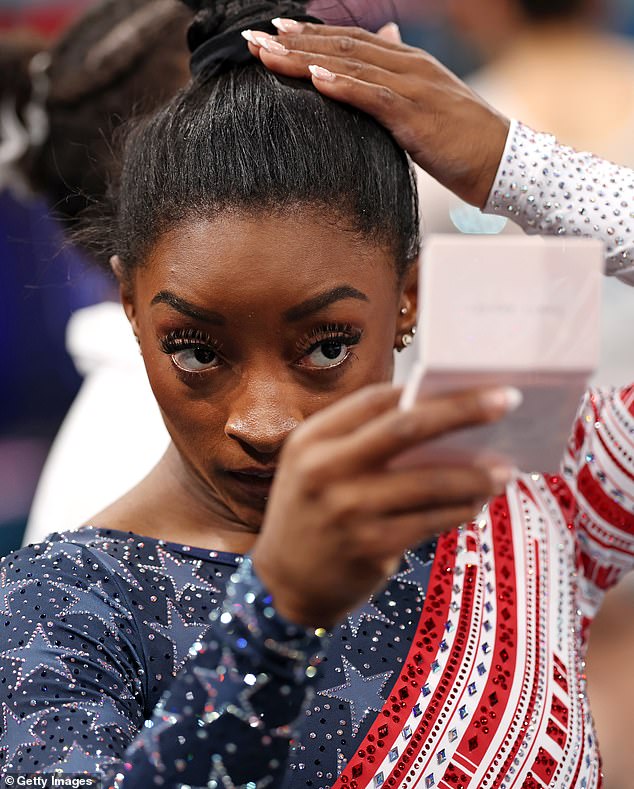 Simone Biles was seen furiously fixing her hair at the Olympic finals - hours after she slammed trolls for making fun of her tresses