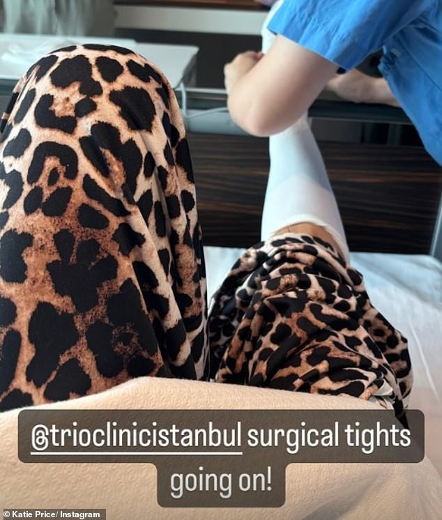 Katie also shared a photo as nurses straightened her surgical tights ahead of surgery