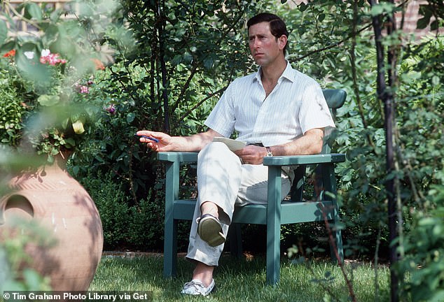 Charles, then the Prince of Wales, sitting in his garden at Highgrove in 1986